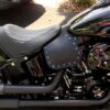 A motorcycle with blue and purple accents on the seat.