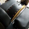A close up of the back rest on a motorcycle.
