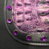 A close up of the purple leather and metal frame.