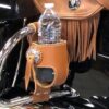 A close up of a bottle holder on the back of a motorcycle