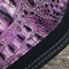 A close up of the purple leather on a car seat
