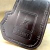 A black leather wallet with the u. S. Army logo on it