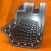 A black leather case with silver rivets on top of an orange background.
