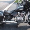 A motorcycle parked on the side of a road.