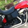 A red motorcycle parked on the side of a road.