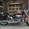 A motorcycle parked in front of a garage.