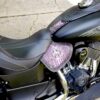 A motorcycle seat with the words " harley davidson ".