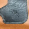 A close up of the leather on a bag