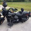 A black motorcycle parked on the side of a road.