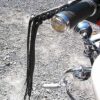 A motorcycle with a black leather handle bar.