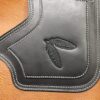A close up of the leather on a brown bag