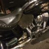 A motorcycle seat and tank cover on the back of it.