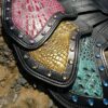 A close up of some leather bags with different colors
