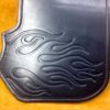 A leather case with flames on it.