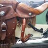 A saddle on the back of a car.