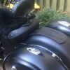 A motorcycle with two bags on the back of it.