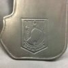A silver bag with a picture of a bear on it.