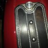 A close up of the leather on the back of a guitar