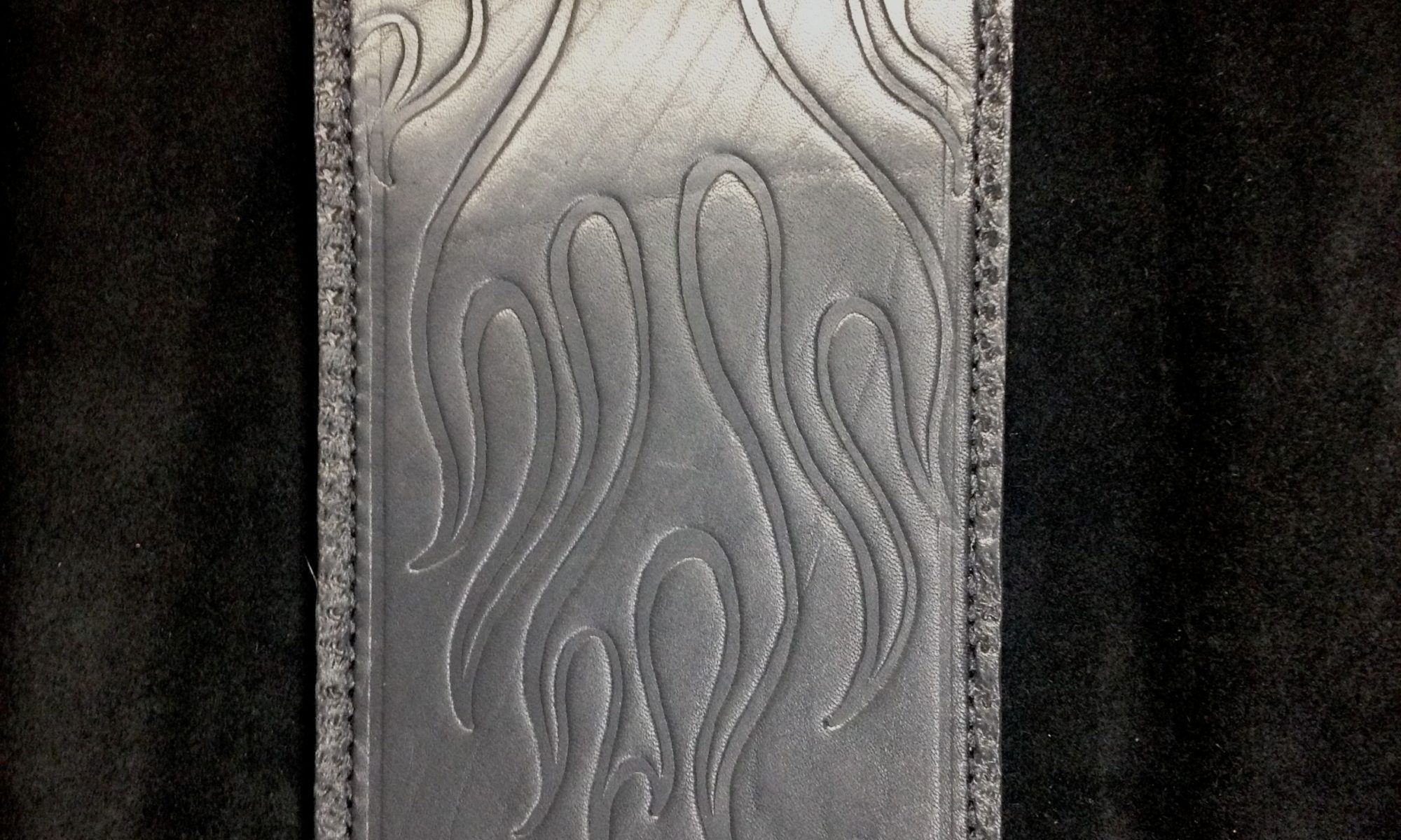 A silver case with flames on it