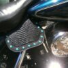 A close up of the seat cover on a motorcycle