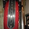 A red guitar with black and silver trim.
