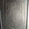 A close up of the logo on a leather wallet.