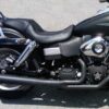 A close up of the seat and front end on a motorcycle.