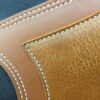 A close up of the leather on a bag