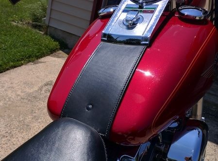 A close up of the tank on a motorcycle.