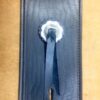 A blue tie with white flower on it