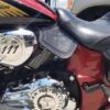 A close up of the seat and engine cover on a motorcycle.