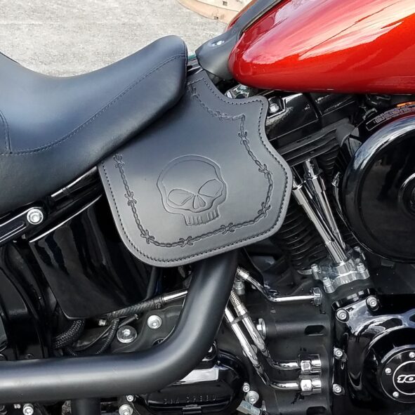 Harley-Davidson heat shield with skull embossing and barb wire tooled border