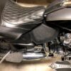 A motorcycle seat with the seat back up.