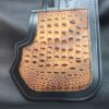 A close up of the leather on a bag