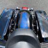A motorcycle engine with blue and black trim.