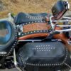 A motorcycle with leather bags and saddle bags.