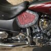 A close up of the seat and tank cover on a motorcycle.