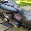 A motorcycle seat with some stickers on it
