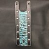 A leather strap with rivets and blue snake skin.