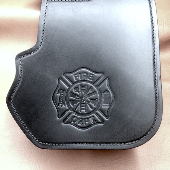Harley heat shield with firefighter emblem embossing