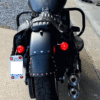 A motorcycle with the rear lights on.