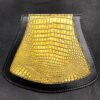 A close up of the yellow and black leather