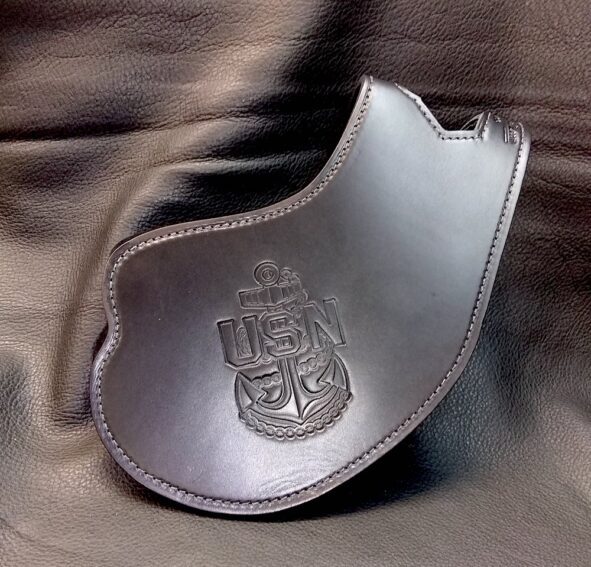 A silver purse with a crest on it.