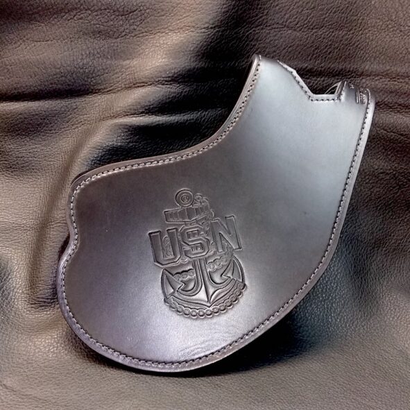 A silver purse with a crest on it.