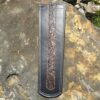 A leather wallet with a snake skin design on it.