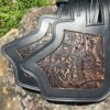 A close up of the back end of a leather purse