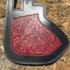 A close up of the back end of a guitar case