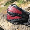 A pair of shoes sitting on top of rocks.