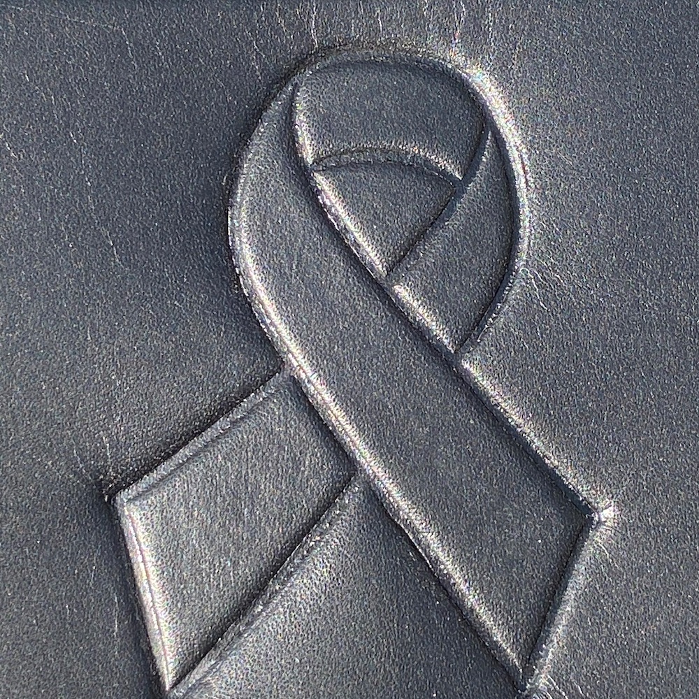 motorcycle heat shield with cancer ribbon