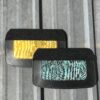 Two leather wallets, yellow and teal.